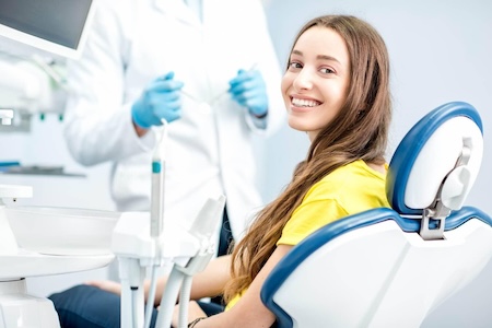 A happy patient at Orthodontist Near You In Aliso Viejo after getting accelerated orthodontics.