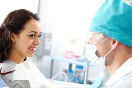 A happy female patient at Orthodontist Near You In Aliso Viejo, CA after getting accelerated orthodontics.