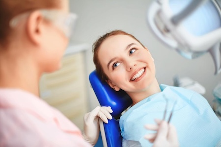 A dentist near you in Aliso Viejo and Laguna Niguel with her satisfied happy female.