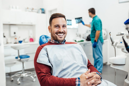 A happy client at the Aliso Creek dental office for dental cleaning.