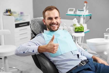 A happy and satisfied patient at Aliso Creek Dental Clinic.