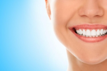 A happy smile after the DDS & DMD expert treatment.