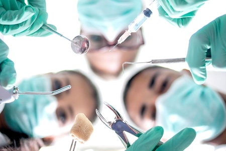 Dr. Mona with her team offering emergency dental service early in the morning.